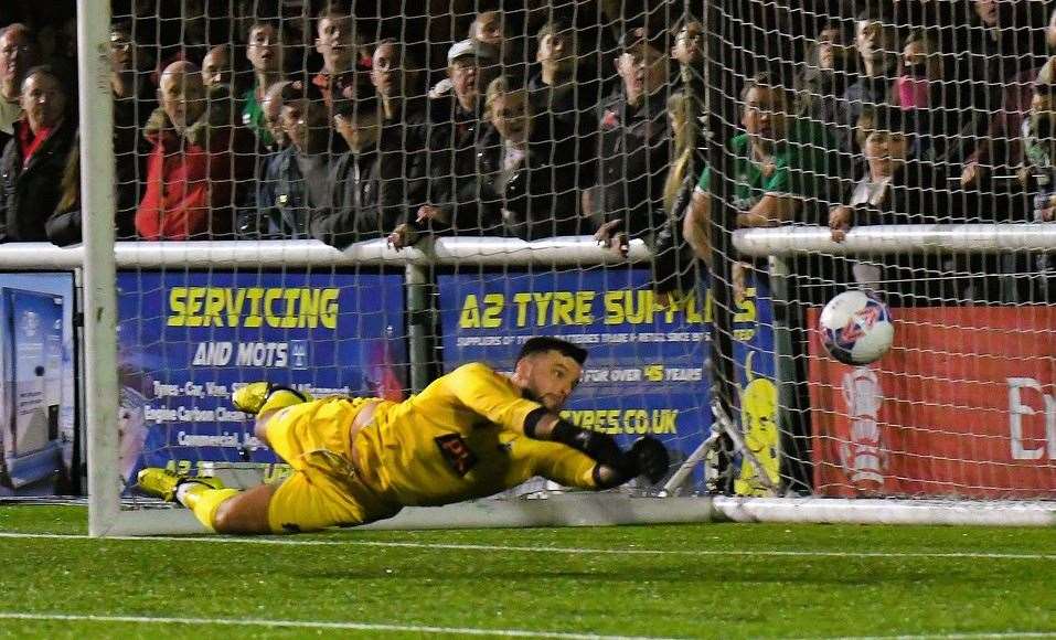 Inspired Sheppey goalkeeper Aiden Prall makes one of 12 saves on the night despite conceding four times. Picture: Marc Richards