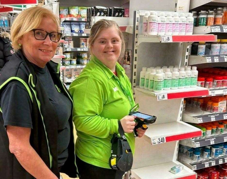 Asda employee Diane Huitson helping Shelley scan items in the Sittingbourne superstore. Picture: ASDA