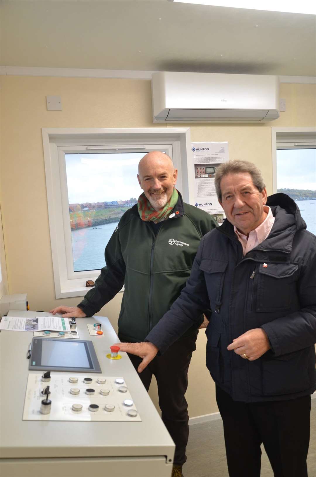 Environment Agency executive director Toby Willison (left) with Sittingbourne and Sheppey MP Gordon Henderson MP in the barrier control room of Queenborough Harbour. Picture: Environment Agency