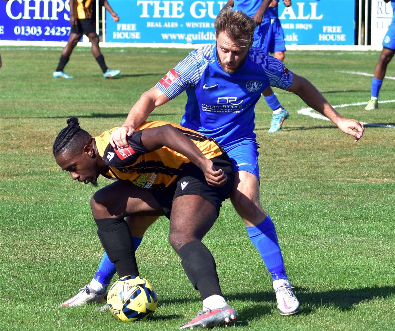 Ira Jackson Jr under pressure for Folkestone against Herne Bay's Jack Parter during their 2-1 win on Monday. Picture: Randolph File