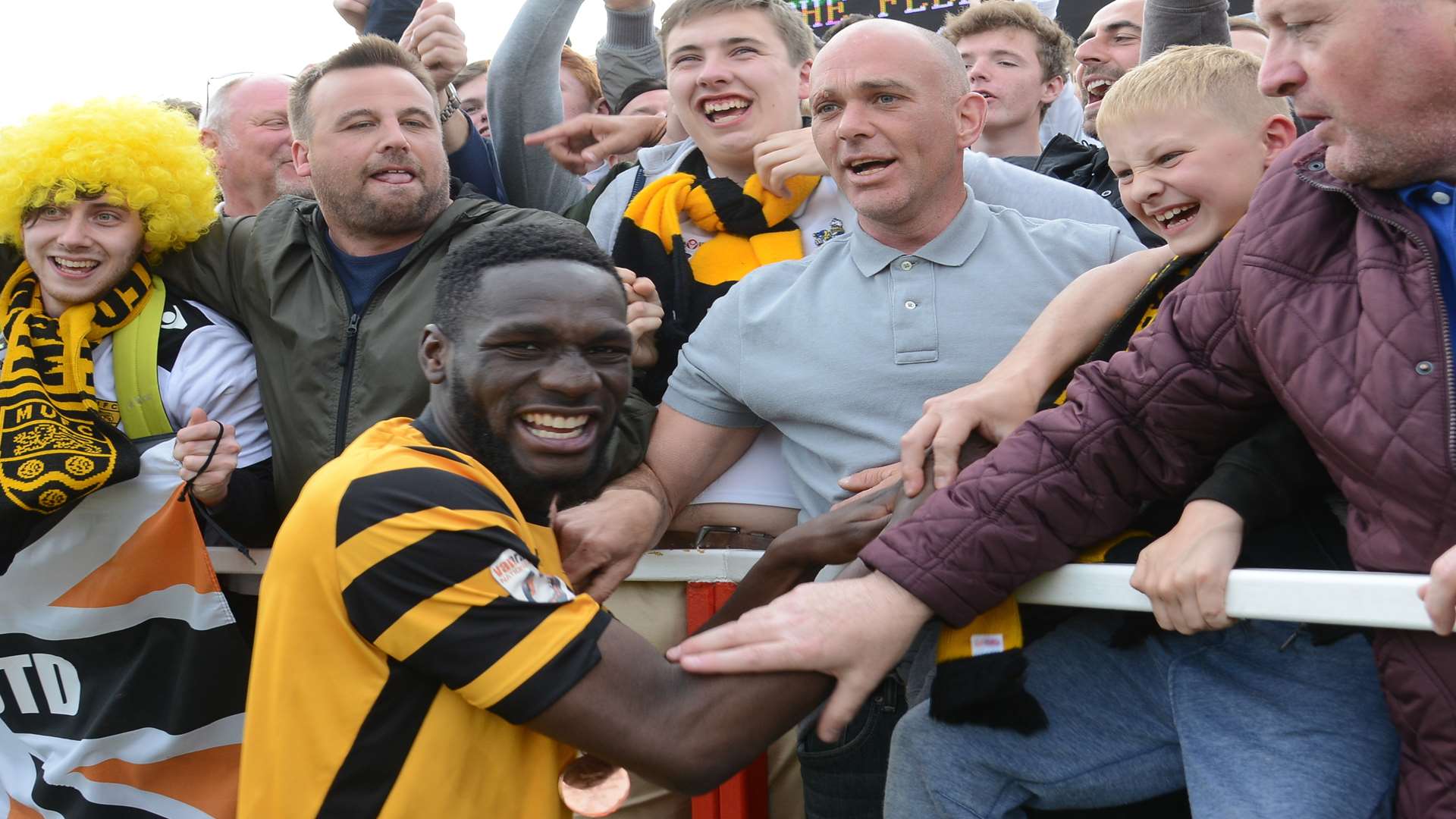 Manny Parry celebrate's Maidstone United's promotion last season Picture: Gary Browne
