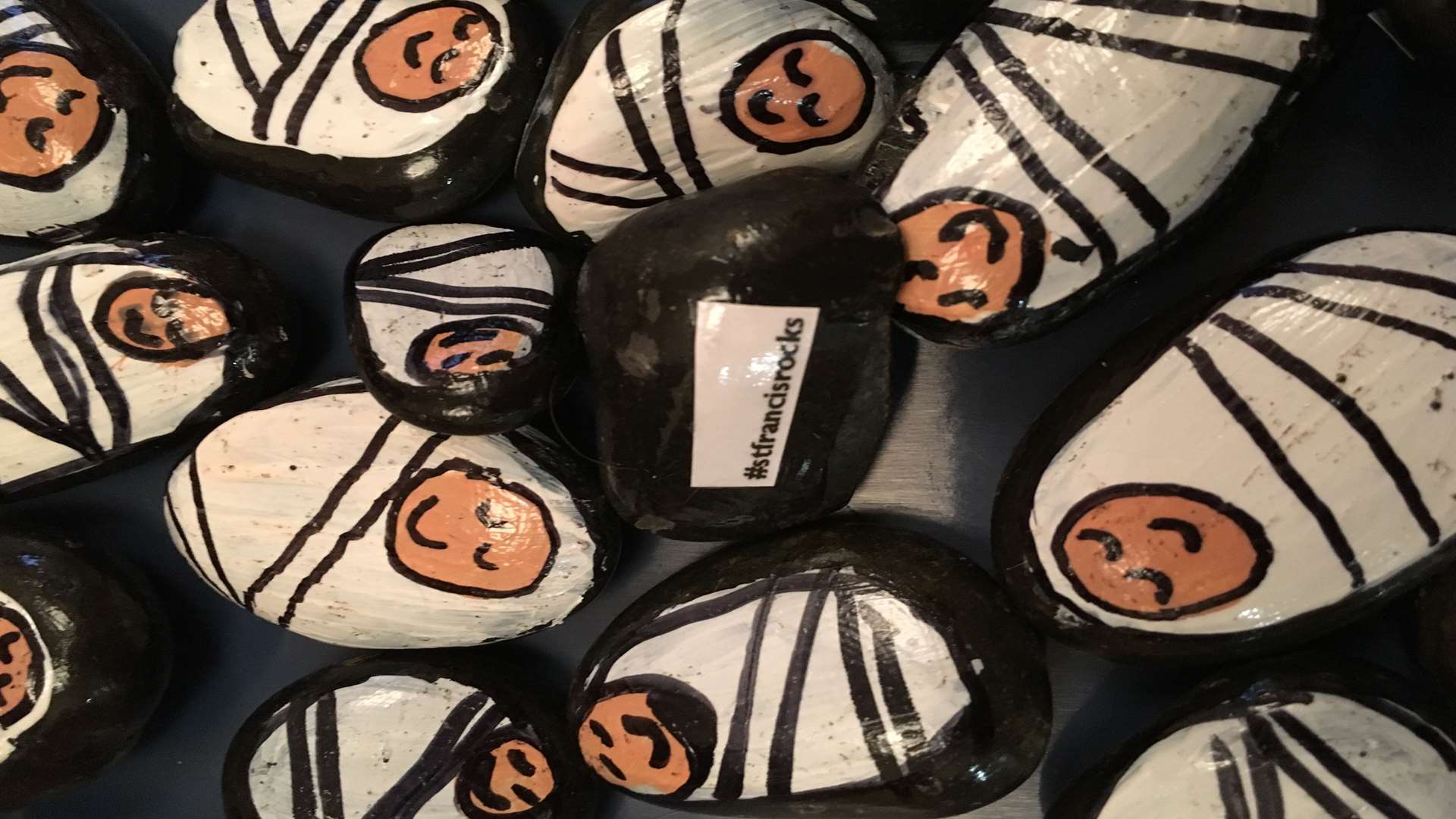 Pebbles painted to look like the baby Jesus