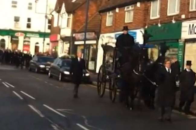 The funeral procession makes its way along Strood High Street