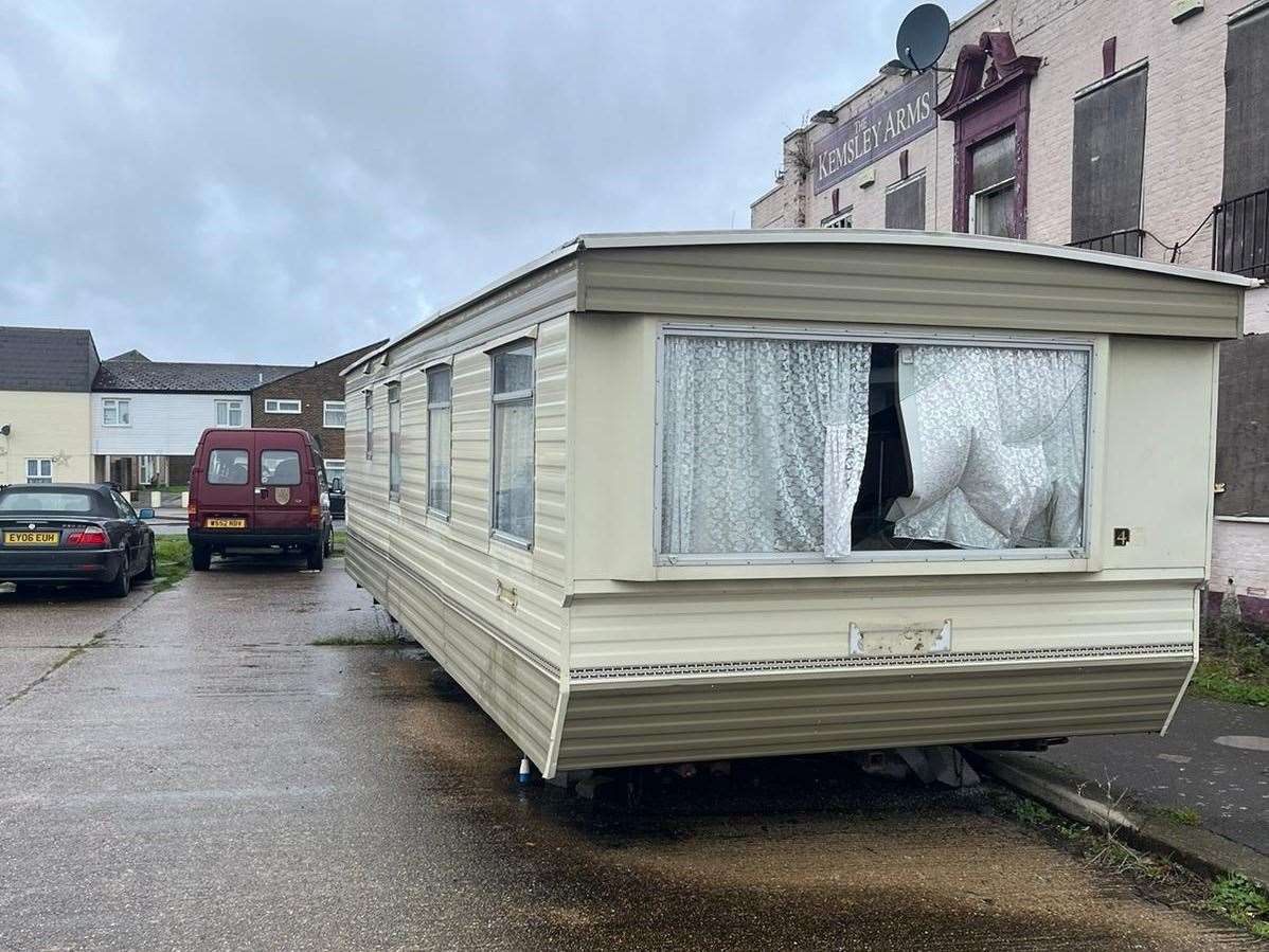 The Kemsley Arms and the vandalised caravan in Ridham Avenue, Kemsley. Picture: Megan Carr