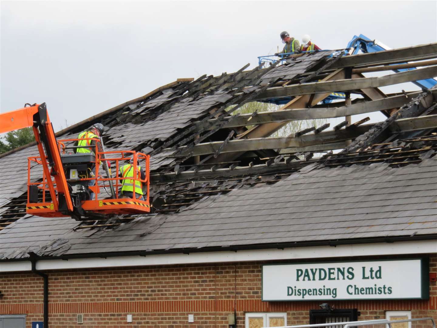 A giant cherry picker was used to bring down the wrecked roof Picture: Andy Clark