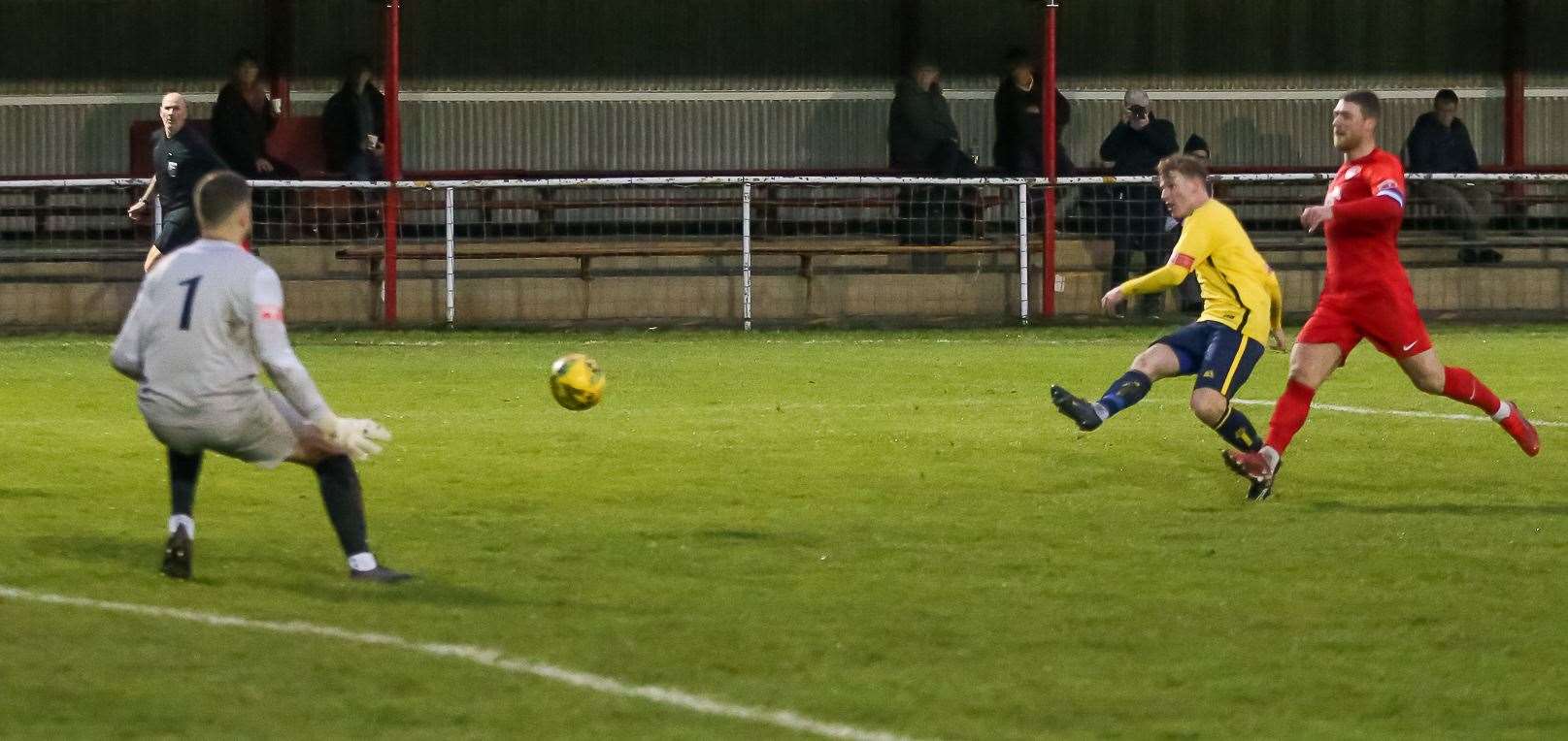 Alex Gaggin scores during Whitstable's 3-0 victory at Hythe. Picture: Les Biggs