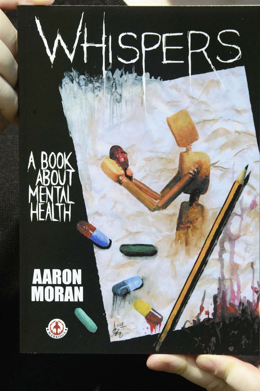 Aaron Moran's book Whispers. Picture: Paul Amos