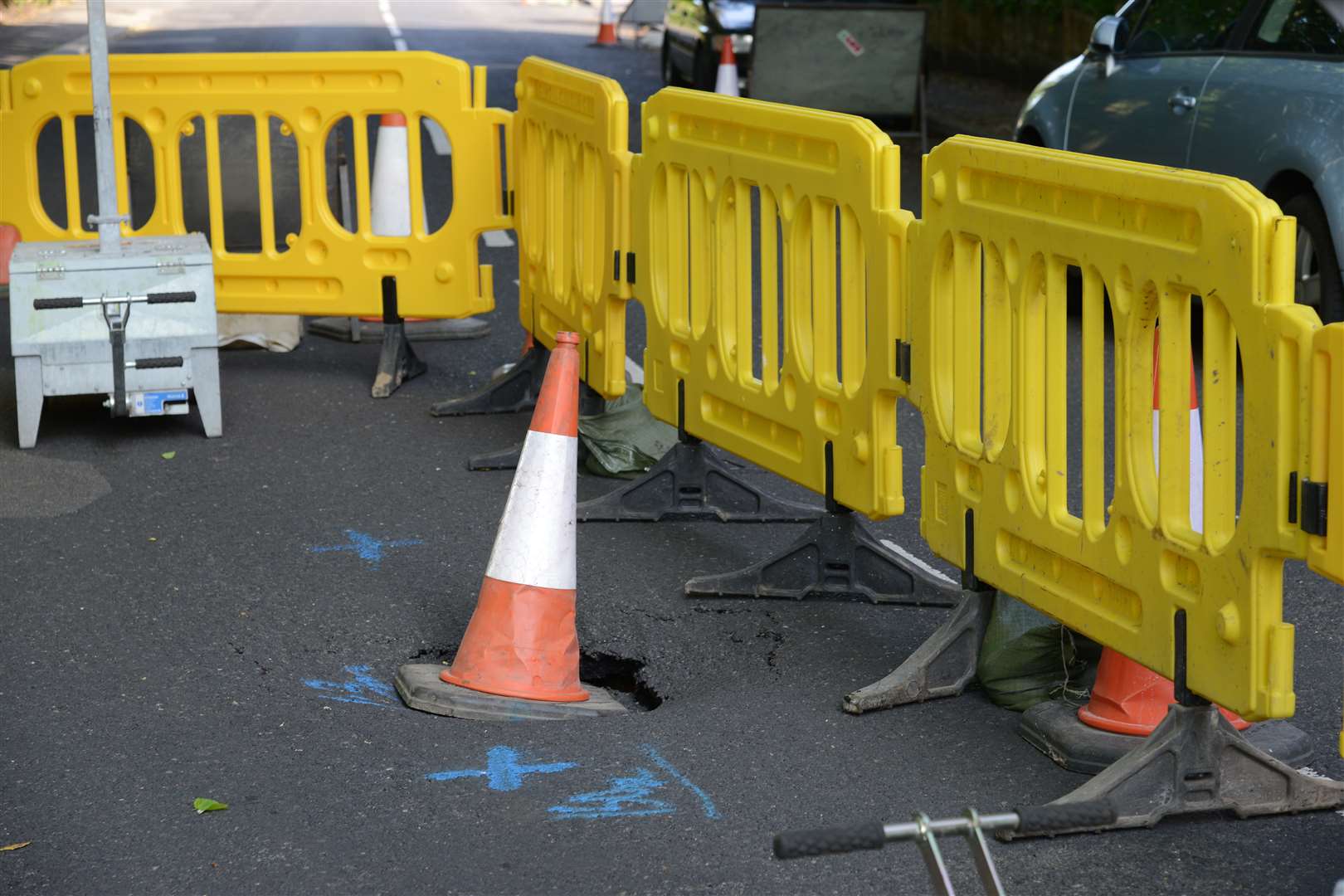 The hole is now coned off and road controlled by temporary traffic lights. Picture: Gary Browne