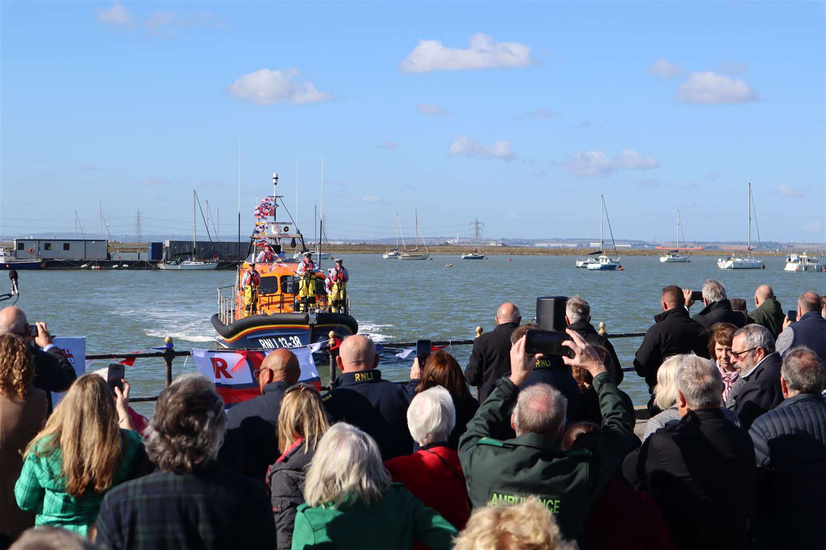 The crowd watches as Sheppey's new RNLI lifeboat the Judith Copping Joyce arrives at Crundall's Wharf, Queenborough, on Saturday