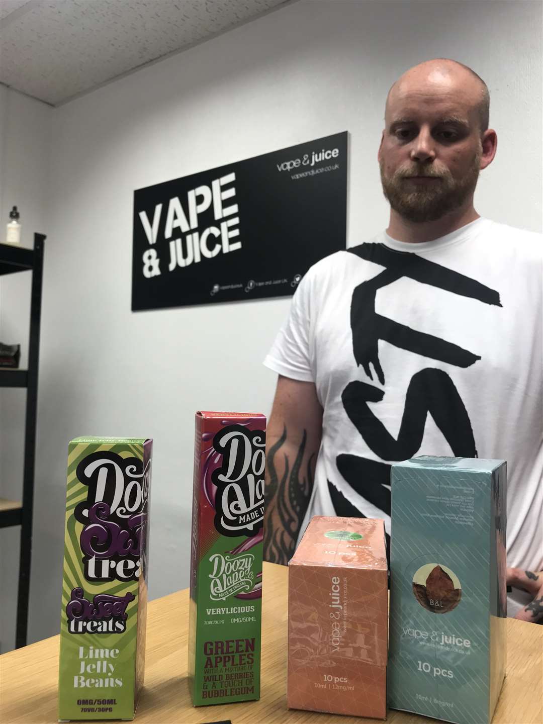 Robb Riddle with Vape and Juice merchandise