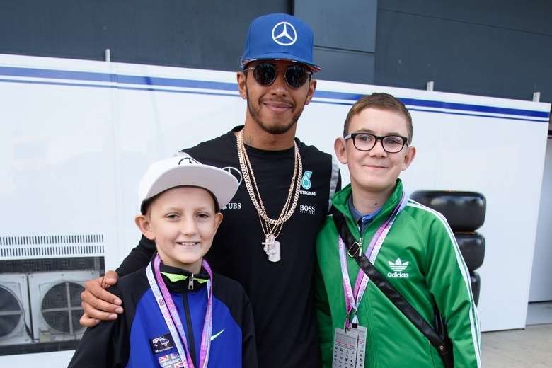 Jacob with Lewis Hamilton. and another patient Ossie Robinson.
