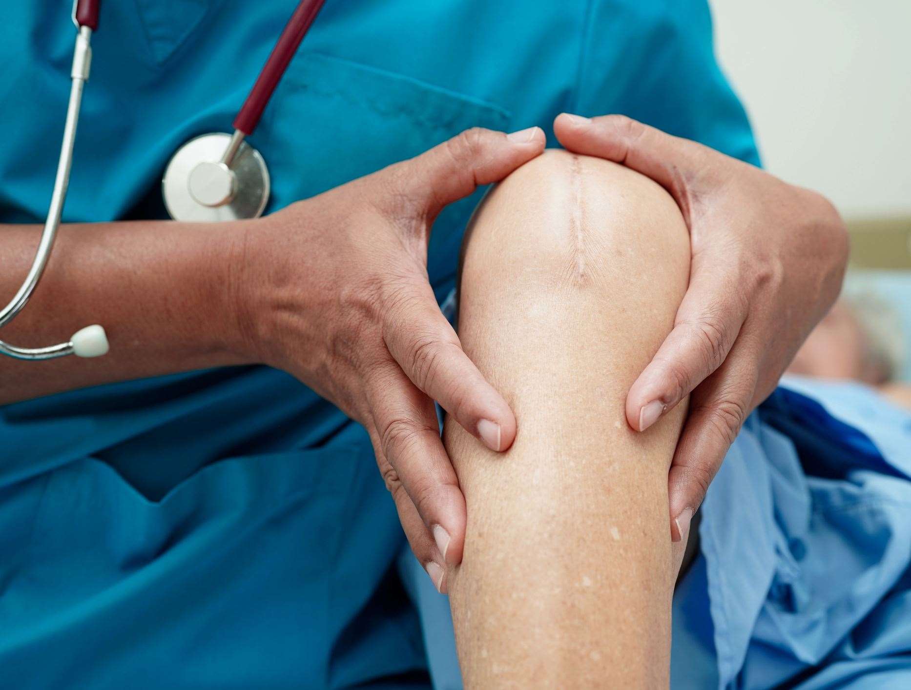 Stock picture of doctor examining a knee