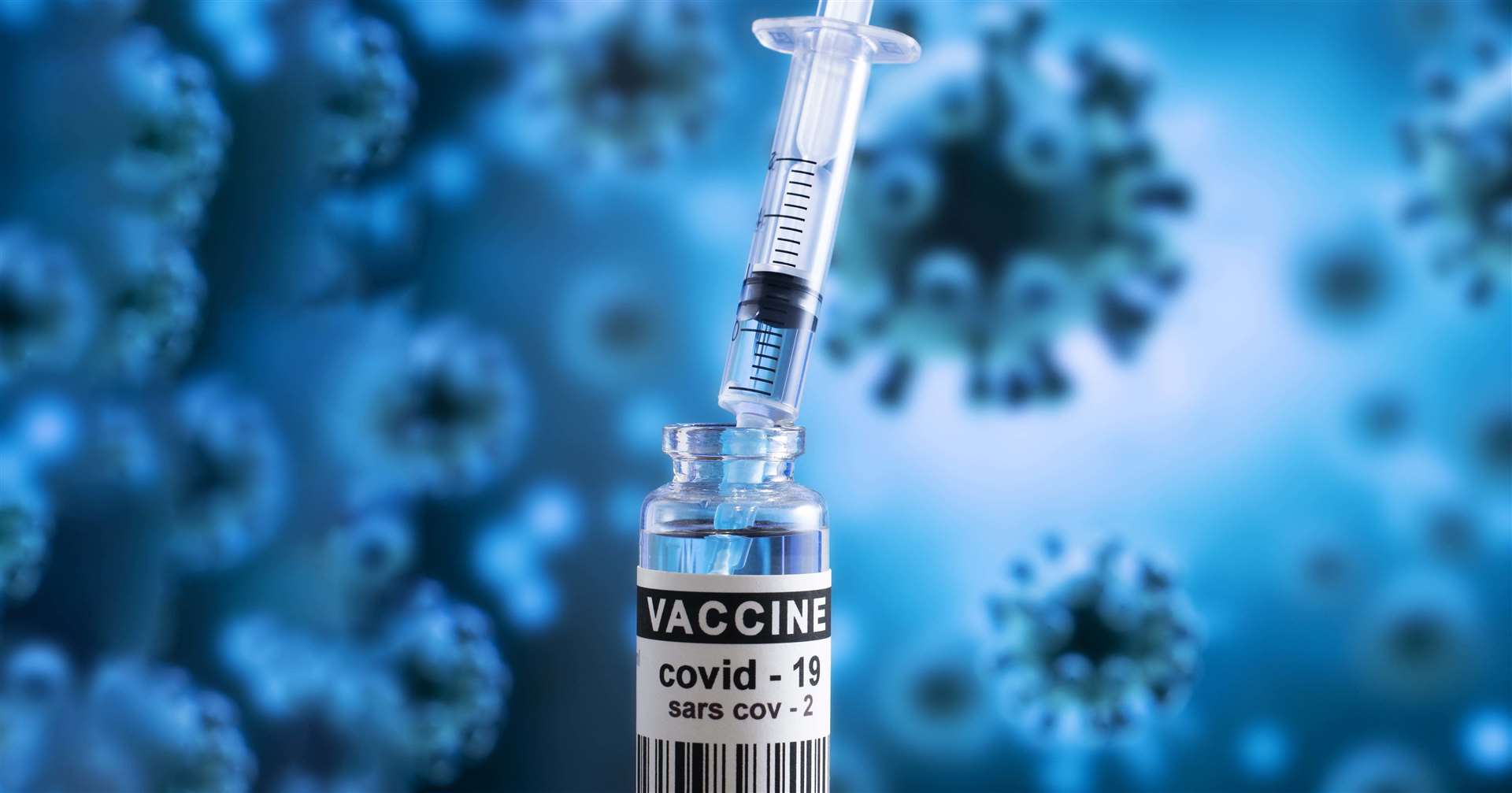 Covid-19 protection. Vaccine and syringe for injection. Stock image.