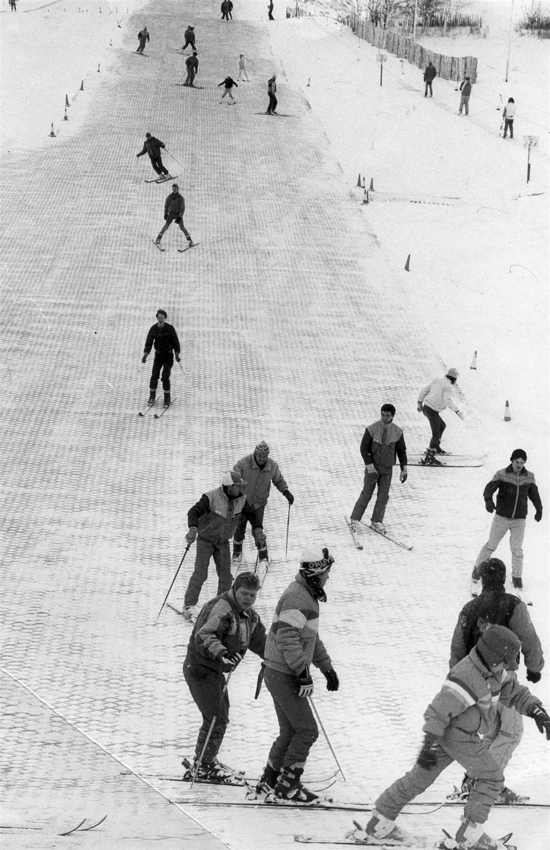 People enjoying real snow on the slopes of the Alpine Ski Centre in Chatham