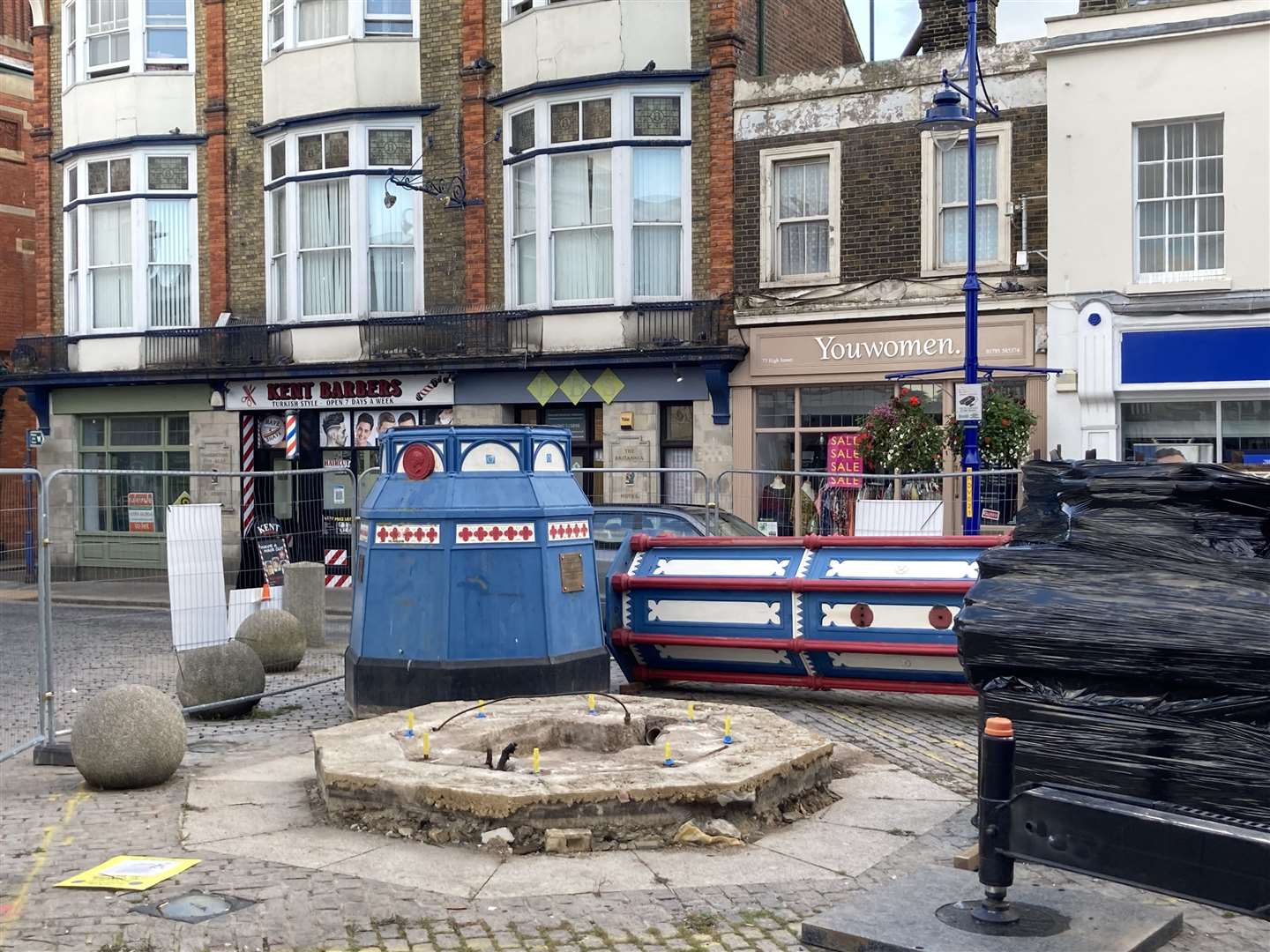 Day three: Sheerness town centre looks strange with its 119-year-old clock tower lying horizontal on the ground waiting to be taken away for restoration by Smith of Derby