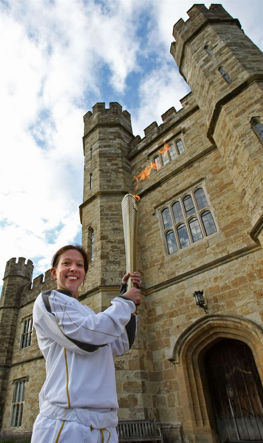 Sarah Shephard carries the flame at Leeds Castle. Pic: Locog