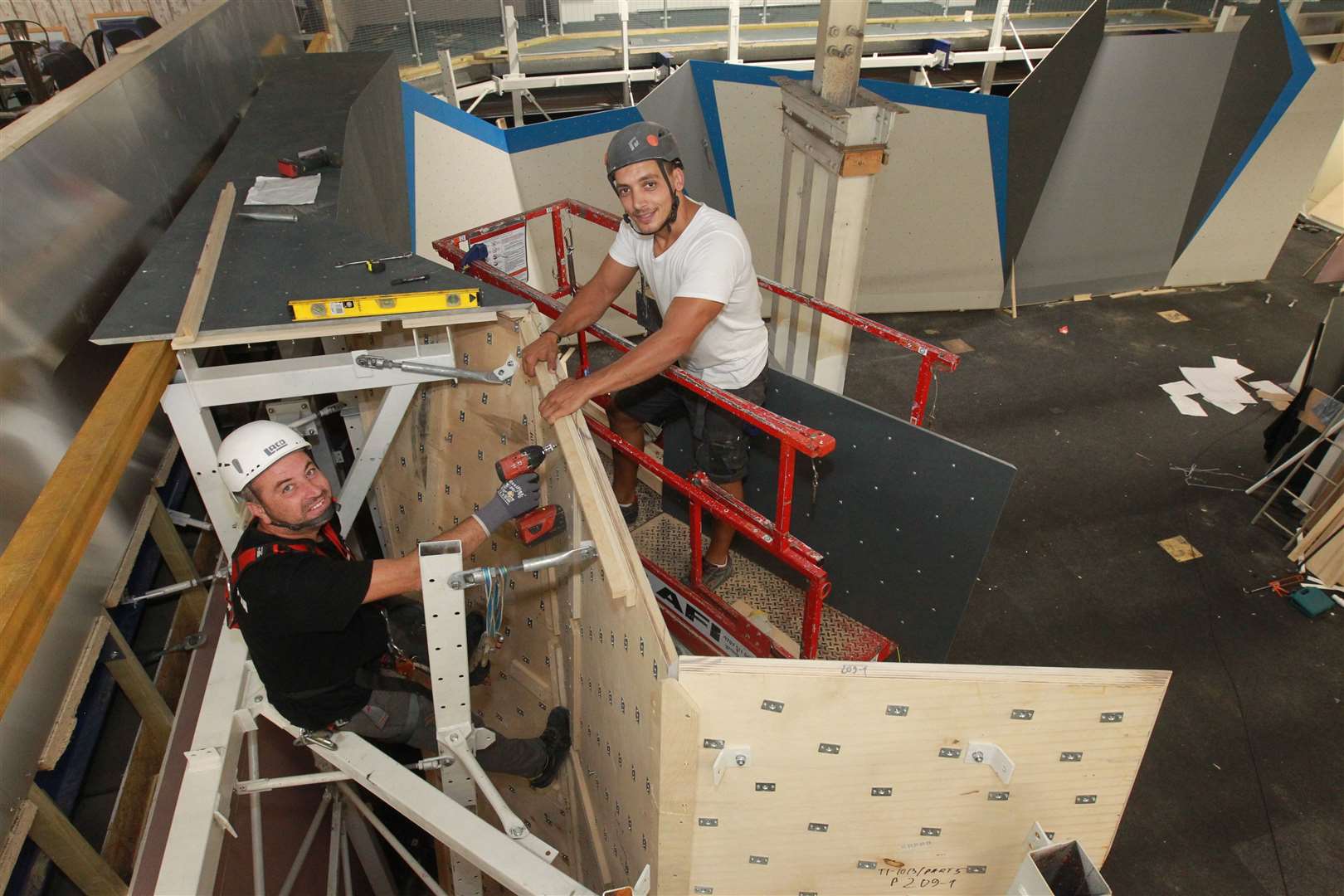 From left, Daniel Miadenov and Stoycho Grozev, from Walltopia, helping to put together climbing walls at The Climbing Experience, that is due to open next month in Maidstone. Picture: John Westhrop.