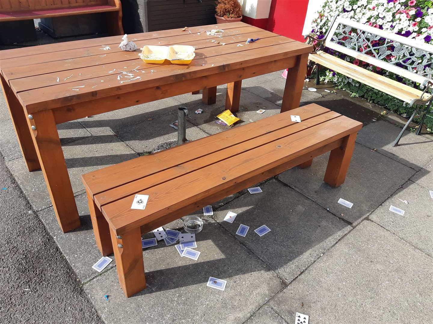 Empty kebab boxes and playing cards have been discarded outside the Deal pub