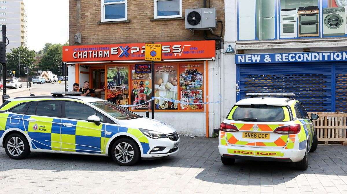 Police outside the Chatham Express shop in the High Street after a disturbance. Picture: UKNiP