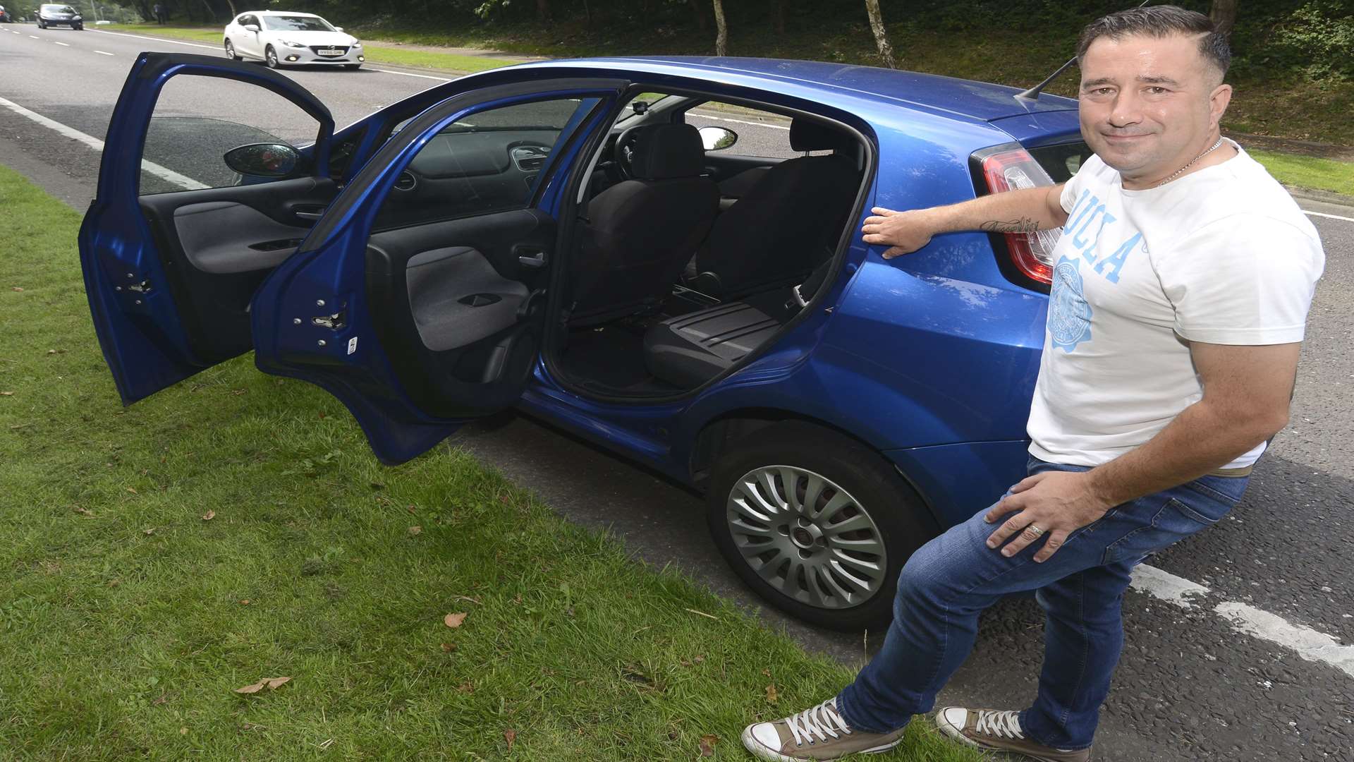 Paulo Berni at the spot where he stopped to deliver his wife's baby in the back seat of their car