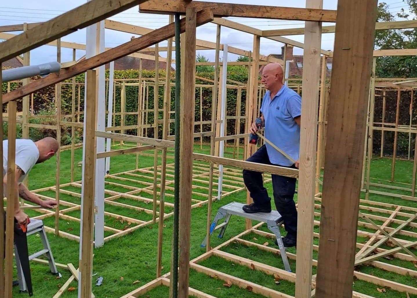 Michael and his stepdad Andrew building the maze. Picture: Michael Steel Clark
