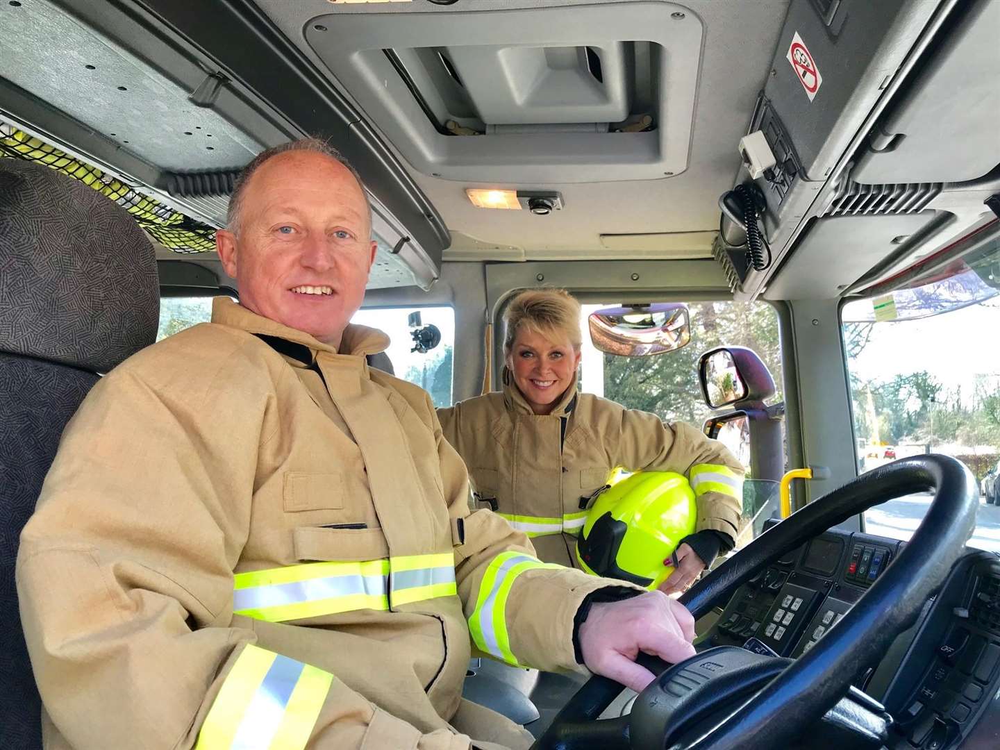 Senior Driving Instructor Dave Gunn, who drove the fire engine during the filming, with Cheryl Baker