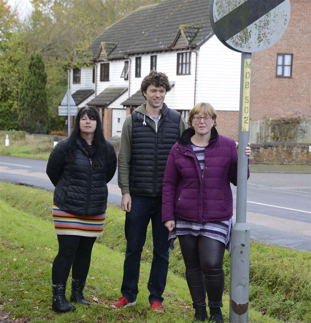 A national speed limit sign outside Imagine play centre. Pictured is Green Party candidate Mandy Rossi, Kingsnorth Parish councillor James Ransley and Cllr Heather Hayward. Picture: Paul Amos