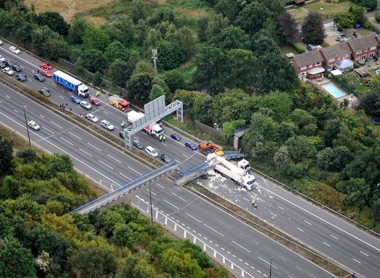 The day in 2016 when the original bridge was struck by an HGV: Picture NPAS Redhill