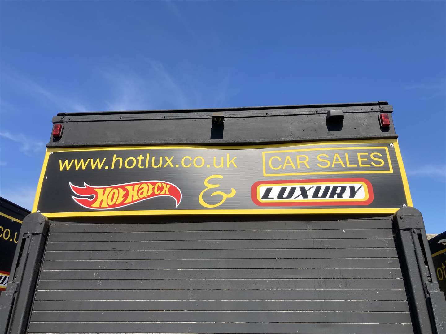 Black vans in the Ship on Shore car park, Sheerness, now have signs for the website www.hotlux.co.uk on them