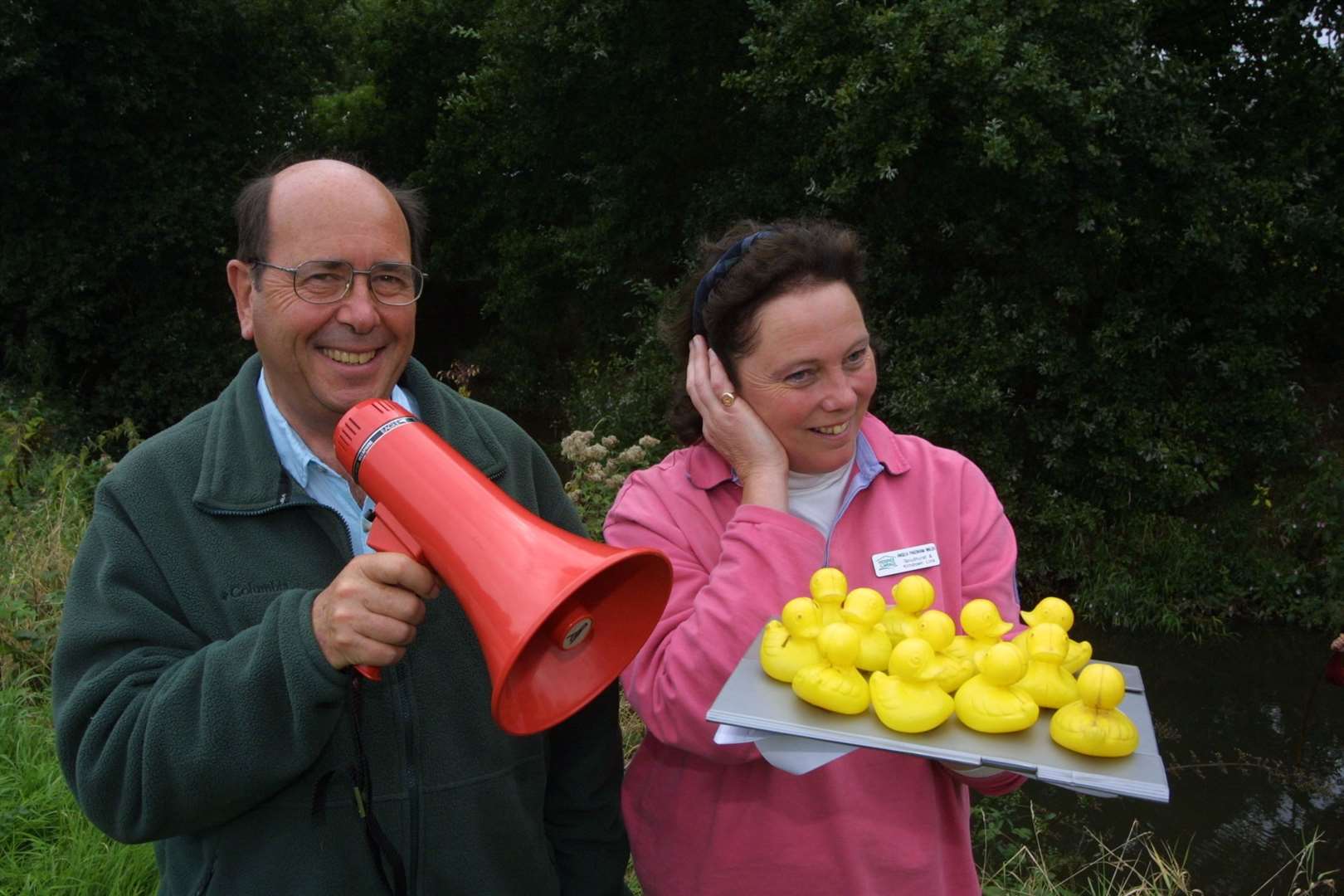 Anthony Farnfield and Angela Packenham-Walsh getting plastic ducks ready for a charity river race in support for the Hospice in the Weald at Harpers Farm, Goudhurst, in 2002
