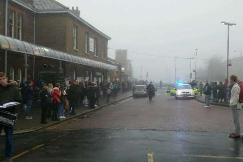 Commuters outside Sittingbourne station following the incident