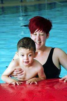 Oliver with mum Natalie, happy in the pool