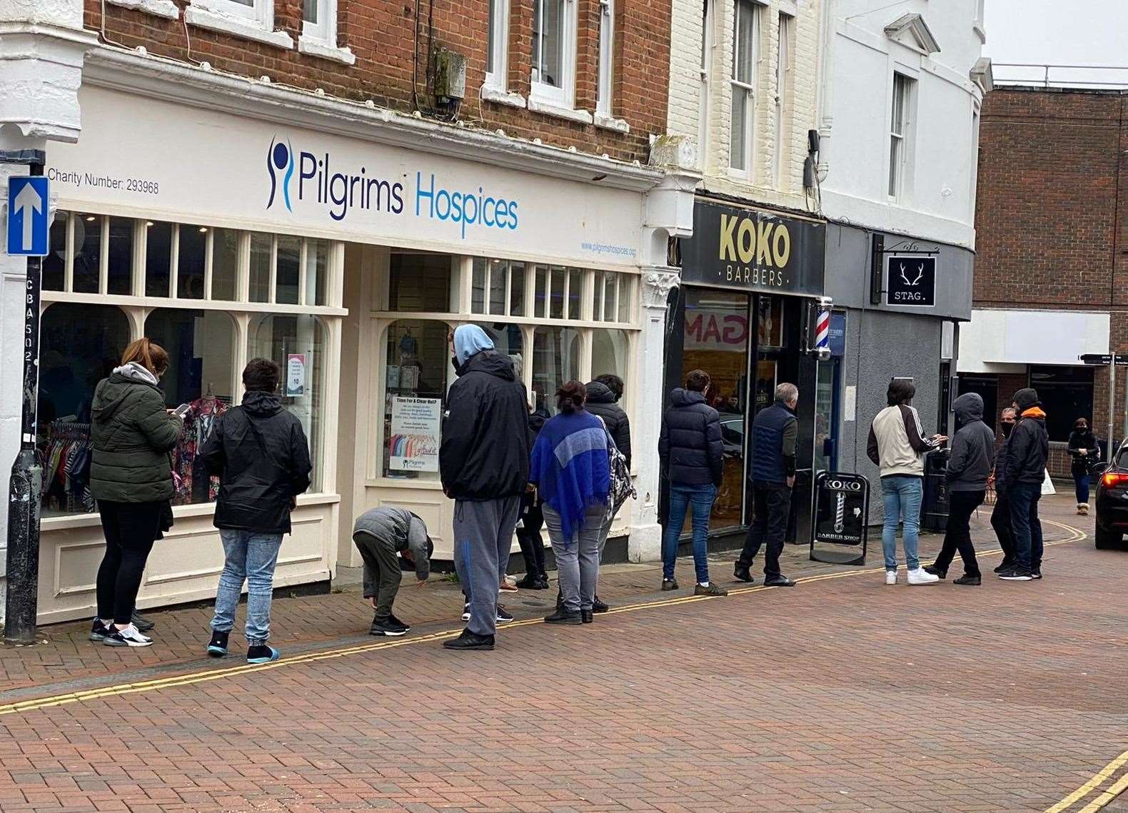 Even before 9am, queues were forming outside barbers in the town centre