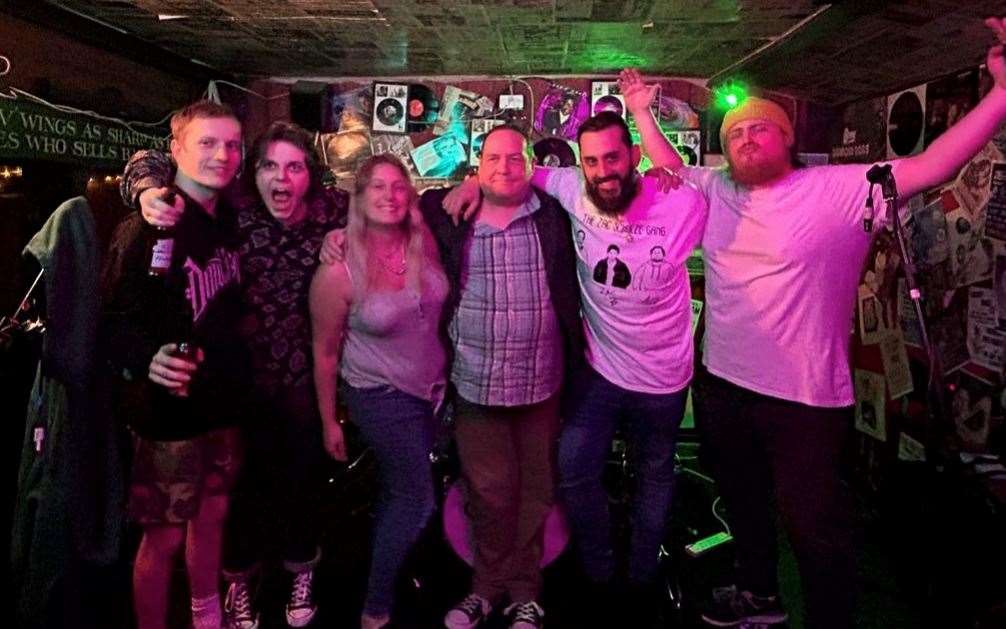 Ship Inn owners Charlotte Robinson (third from left) and Nathaniel Reagon-Welch (second right) with one of the bands who have perfomred at the pub. Picture: Nathaniel Reagon-Welch