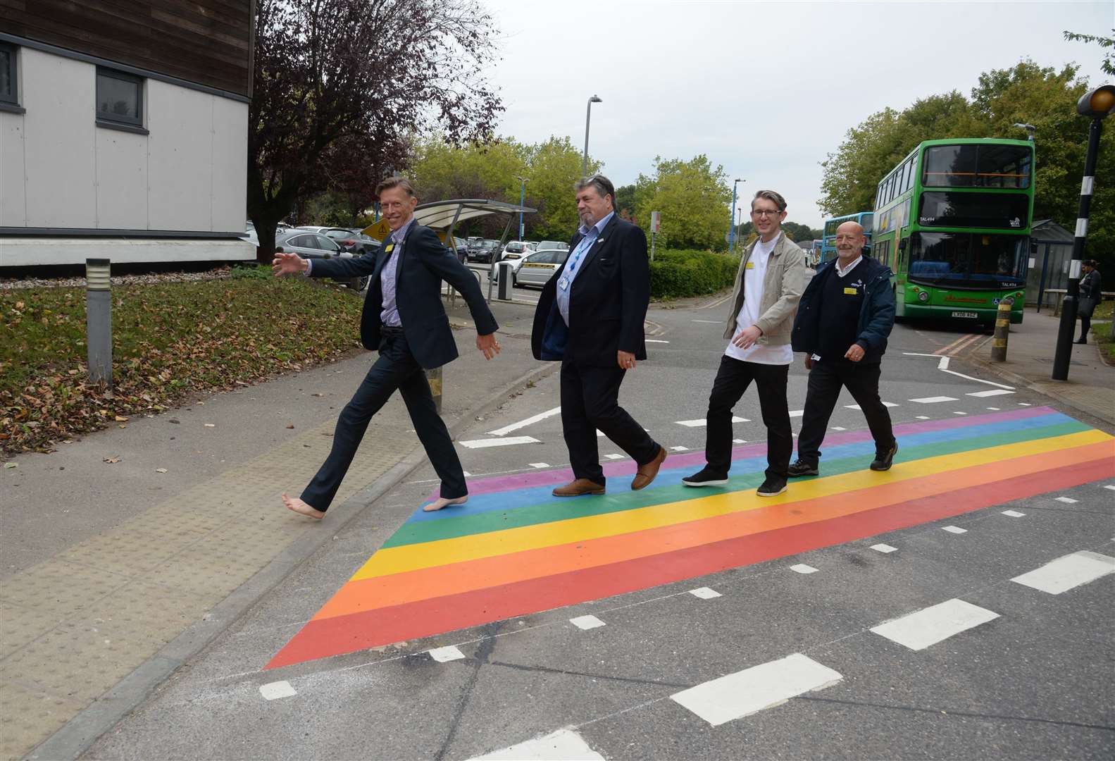 The NHS trust's chief executive Miles Scott, board chairman David Highton, theraphy radiographer Alex Beardmore and chairman of the LGBT Network Mick Stupple try out the rainbow crossing at Maidstone Hospital