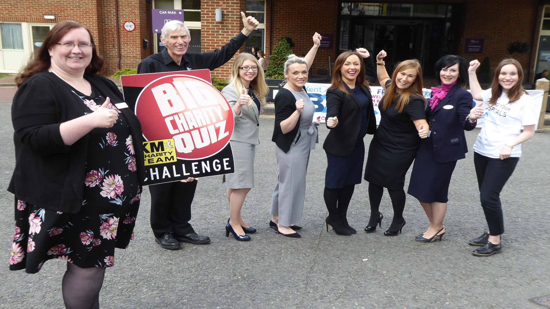 Rebecca Naylor of Ashford International Hotel launches the KM Big Charity Quiz with key partners Hallett and Co, Specsavers, Office Angels, and East Kent Hospitals Charity.