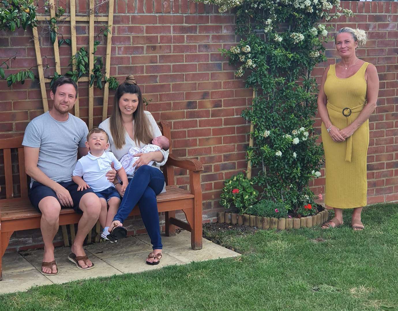 Robert and Emma with their children, Arthur and Sienna, and neighbour Mandy Petrou