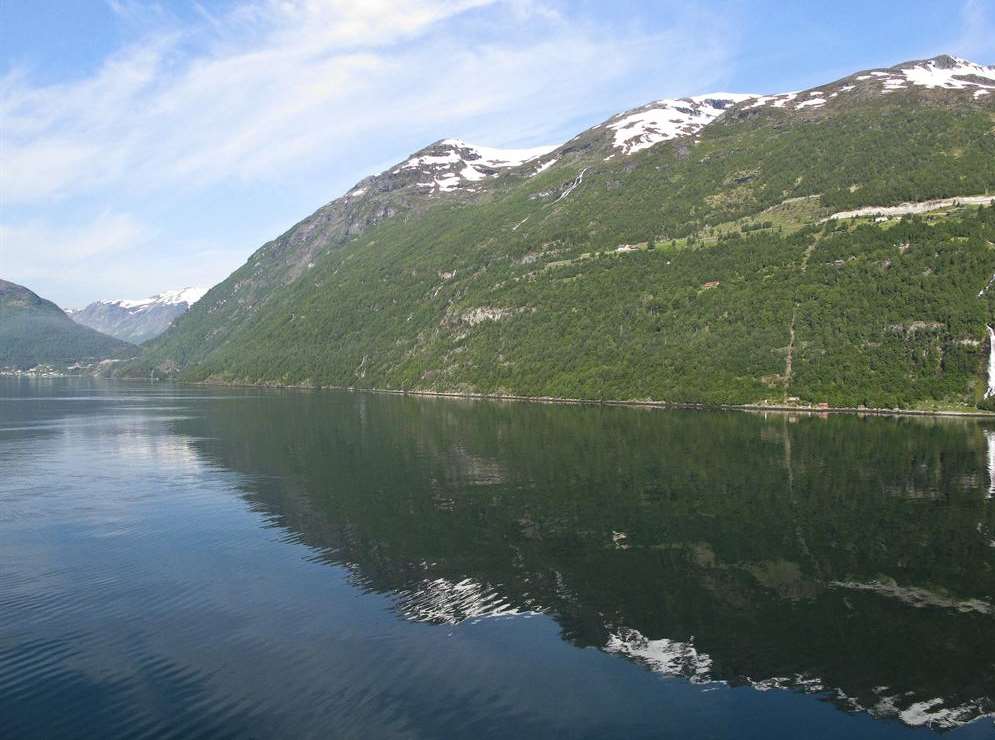 Mountains reflected in the water at Geirangerfjord. Picture: Suz Elvey