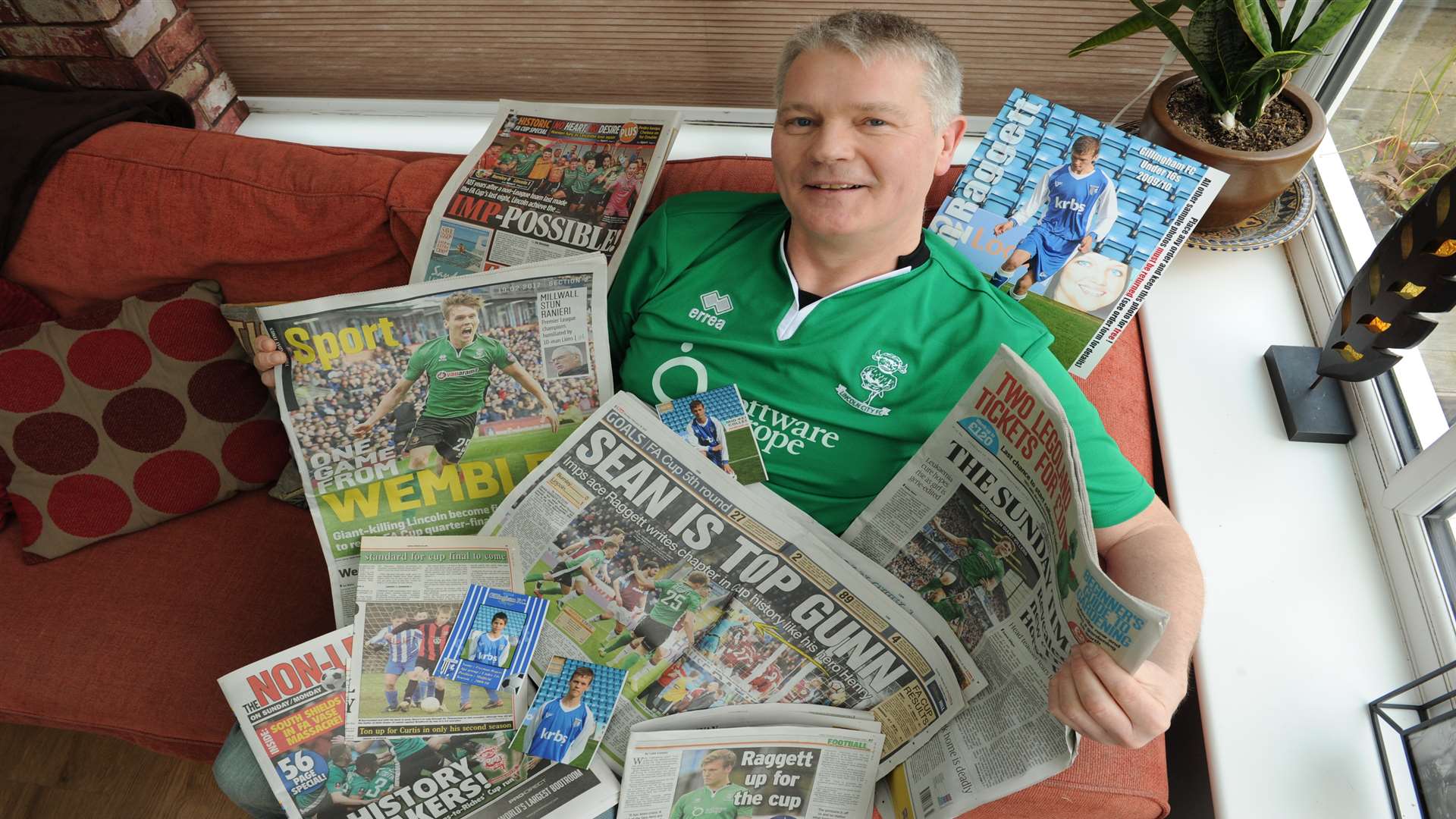 Proud dad John Raggett with Sundays' papers