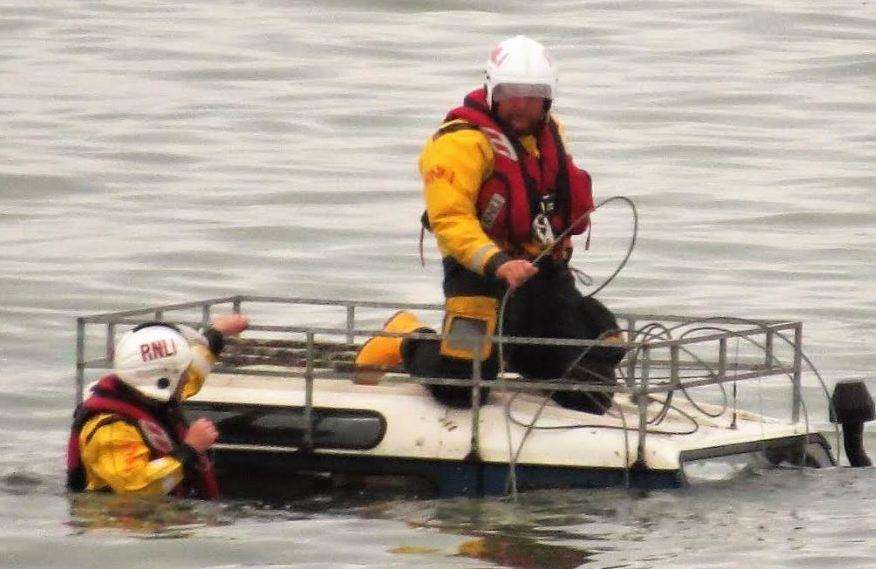 Lifeboat crews with the submerged vehicle