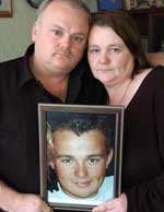 Colin and Trish Davis with a picture of their son Lee, who was killed in September 2005