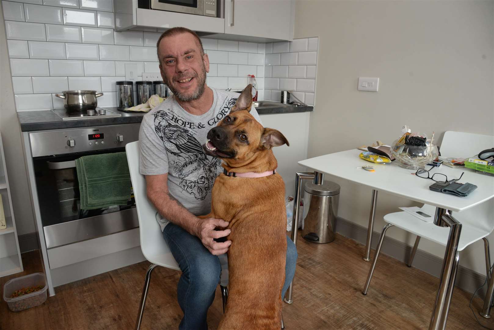 Paul Wallis and his dog Callie in their new home in Brenchley House. Picture: Chris Davey. (13698736)