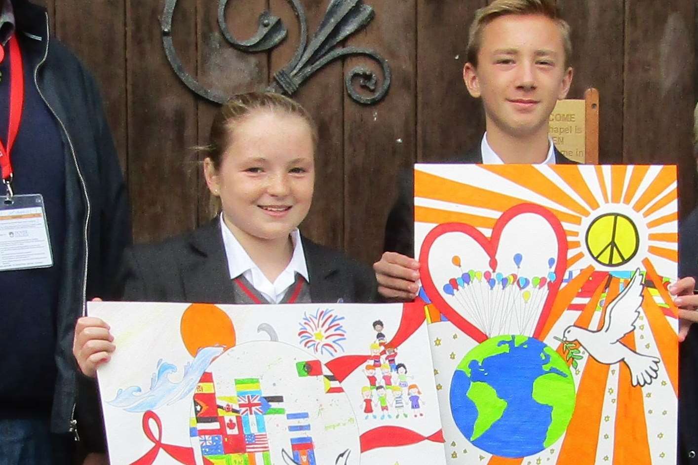 Charlotte Hide and Thomas Baker with their peace posters.