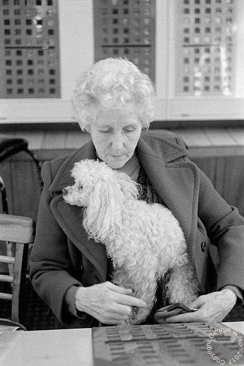 A woman and her trusty companion enjoying the bingo. Copyright: George Wilson