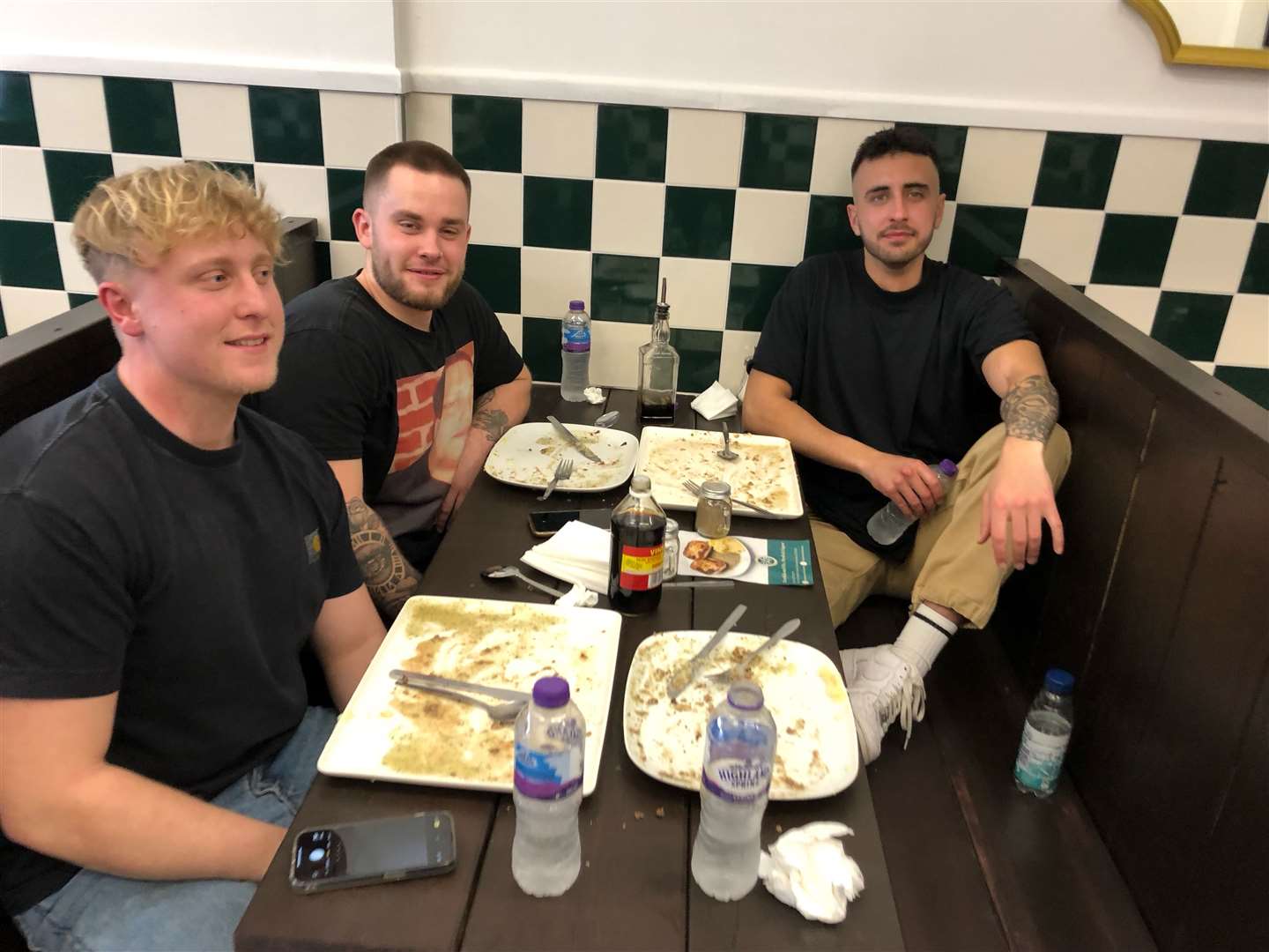 Three extremely smug looking friends who completed the five-pie challenge at Flo's in Folkestone
