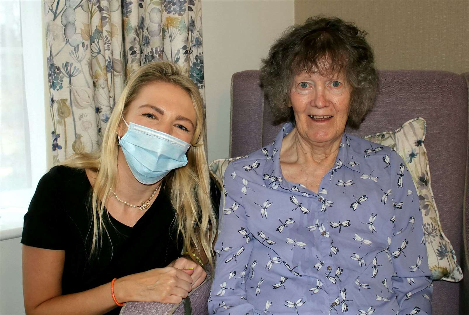 Maddy, 30, with care home resident Brenda Cross, 82. Picture: SWNS