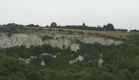 DANGER ZONE: The quarry, with the picnic area top right and the ledge running horizontally along the centre of the picture. Photograph: PETER STILL