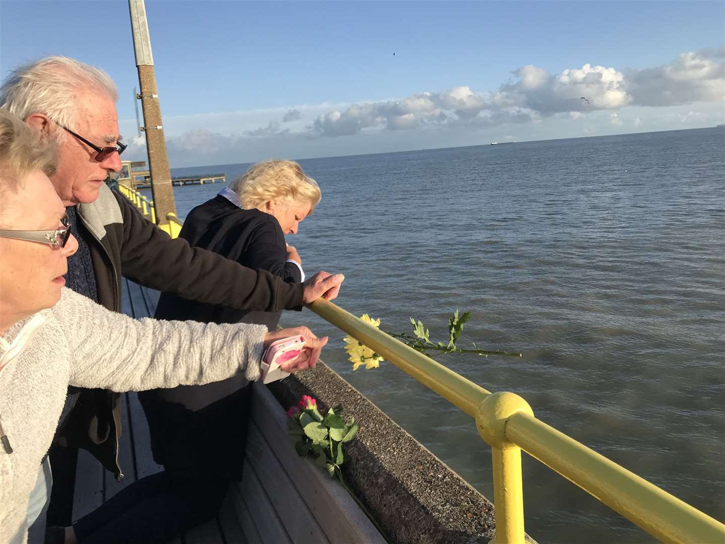 Friends and family of Debbie Griggs threw flowers in to the sea at Deal in her memory