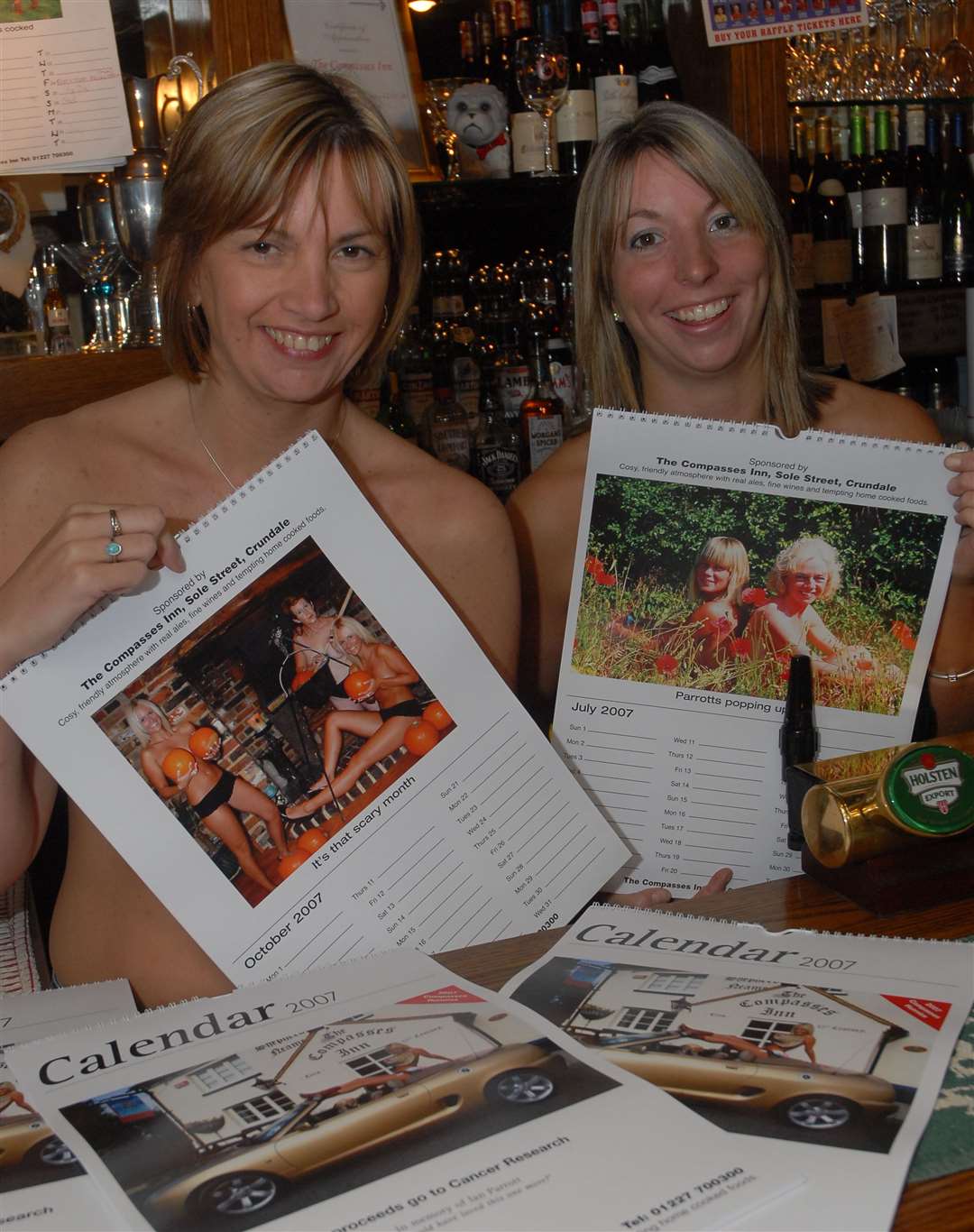 Compasses former landlady Lisa Smart, left, is joined by Rosie Baur to promote the pub's charity calendar