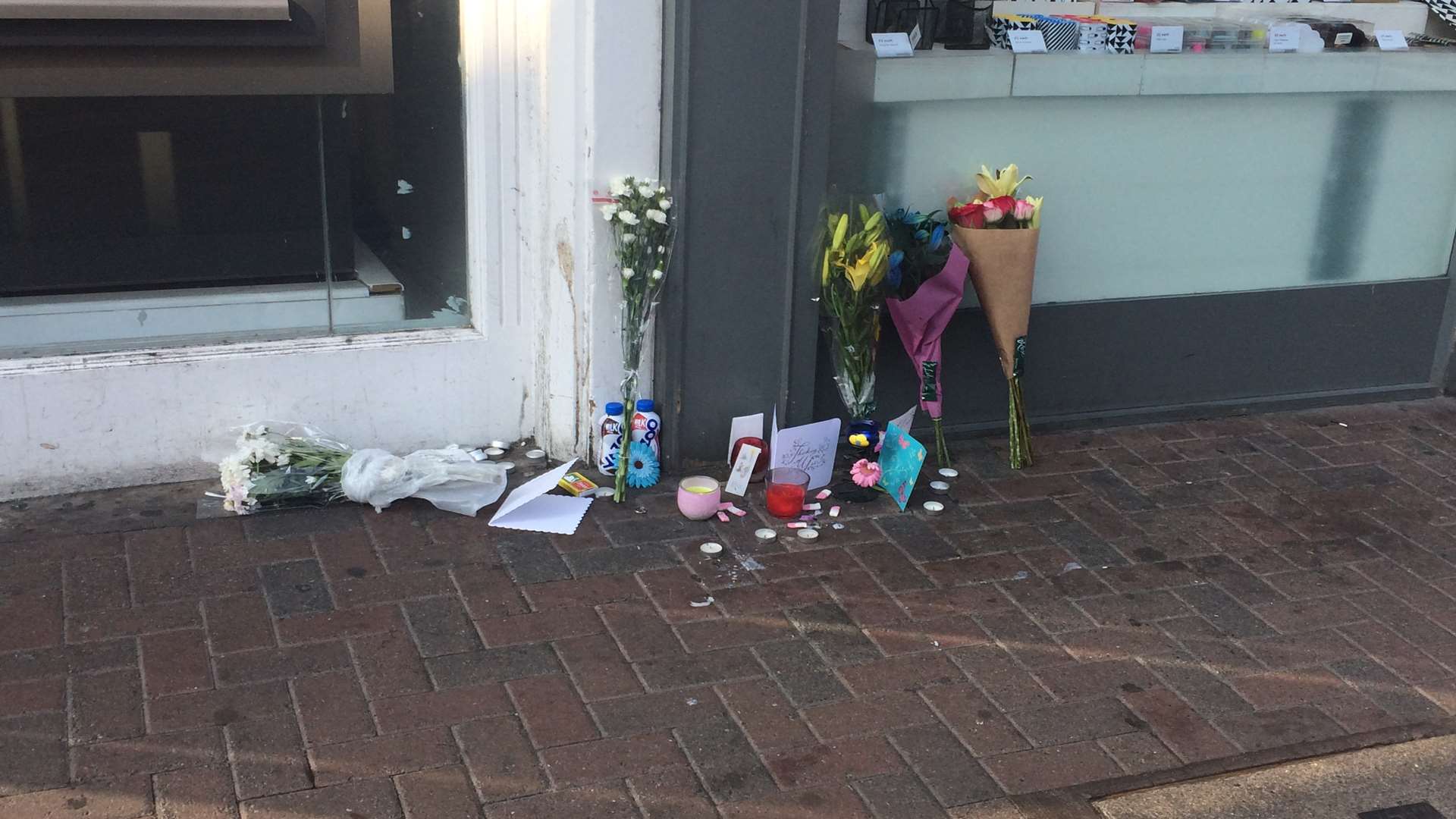 Floral tributes have been left in Week Street